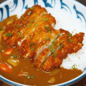 Crispy chicken katsu curry with Japanese curry sauce and rice.