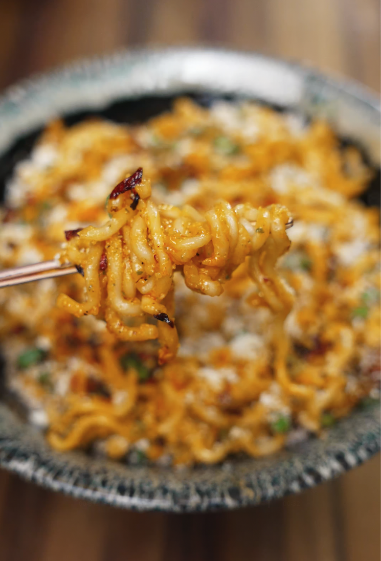 Final Bowl of Instant Carbonara Ramen with Cheese and Scallions