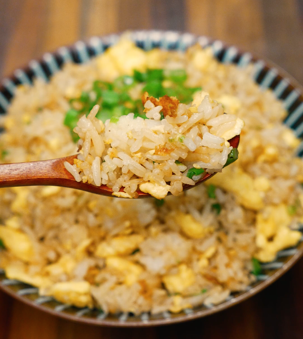 crispy egg fried rice on spoon close up – easy Asian rice recipe