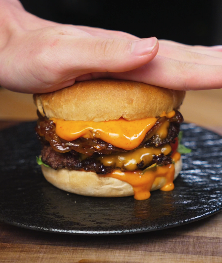 Sliced onions cooked with soy sauce, sesame oil, and sugar until jammy and golden, creating the sweet-savory topping for the Asian Smash Burger.