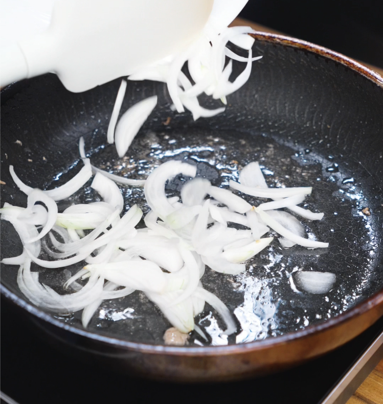 Thin slices of onion cook in the same skillet used for pork, soaking up flavor and becoming caramelized and tender.