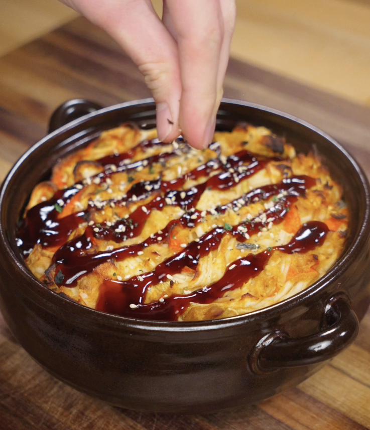 Eel sauce and furikake are sprinkled over the freshly baked sushi casserole while still warm.