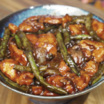 Final plated string bean chicken with tender chicken breast, crisp green beans, and a glossy savory sauce, ready to serve as a healthy Asian dinner.
