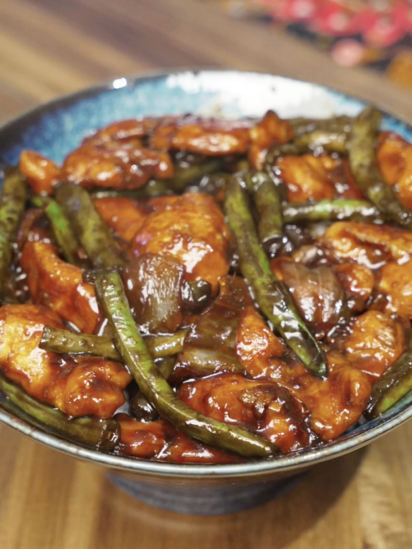 Final plated string bean chicken with tender chicken breast, crisp green beans, and a glossy savory sauce, ready to serve as a healthy Asian dinner.