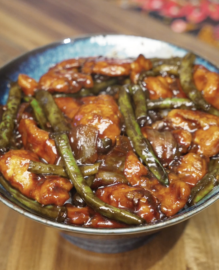 Final plated string bean chicken with tender chicken breast, crisp green beans, and a glossy savory sauce, ready to serve as a healthy Asian dinner.