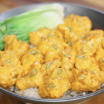 Creamy sweet and spicy bang bang chicken served over steamed white rice with tender bok choy and sliced scallions for a quick high protein Asian dinner.