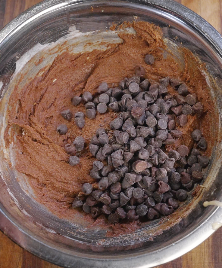 Dark chocolate chips folded into double chocolate brown butter cookie dough for rich chocolate pockets.