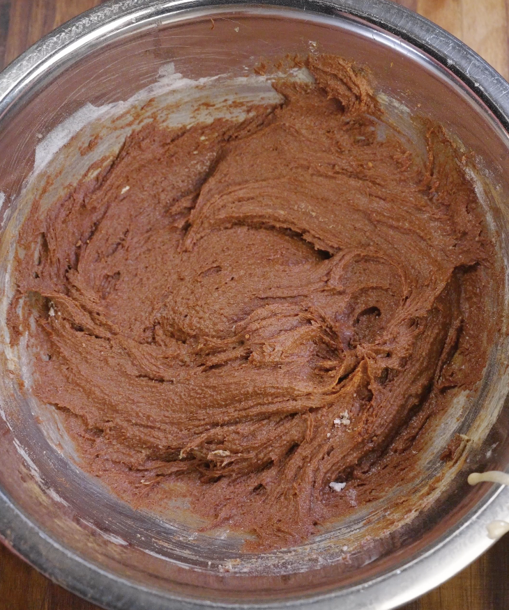 Thick and smooth double chocolate brown butter cookie dough fully mixed with cocoa powder and sugar.