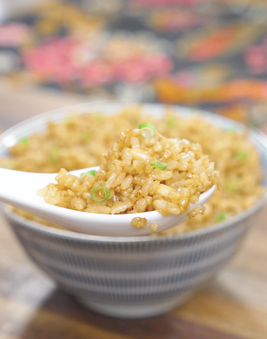 A spoonful of Garlic Butter Fried Rice Recipe showing fluffy rice coated in garlic butter.