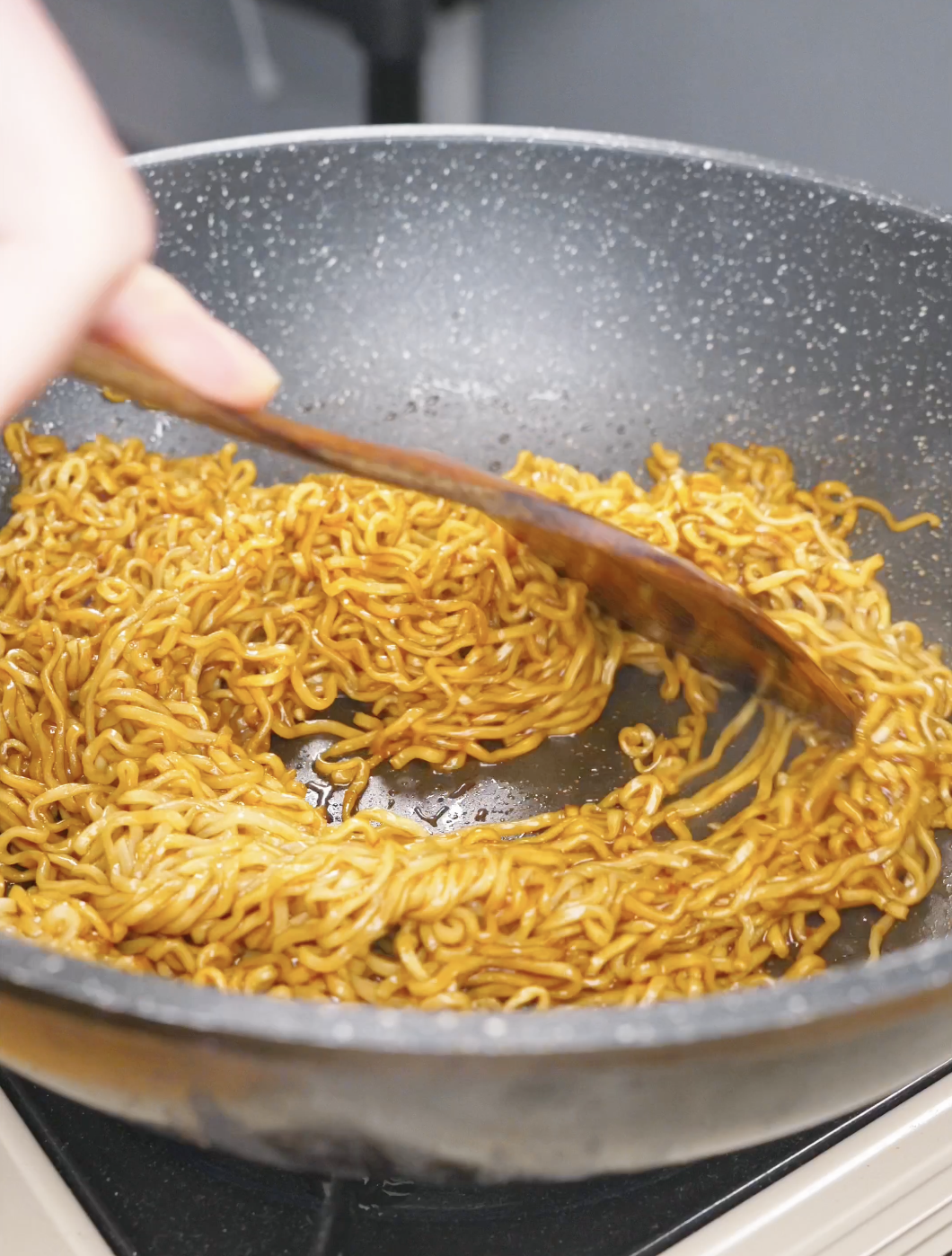 Noodles being tossed until fully coated in the glossy soy butter sauce for Soy Butter Noodles Recipe.