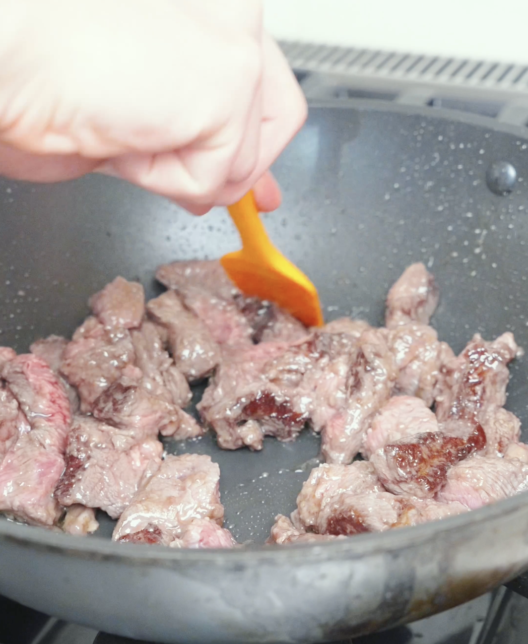 Marinated steak cubes searing in a single layer in a hot pan for Black Pepper Steak Bites Recipe.