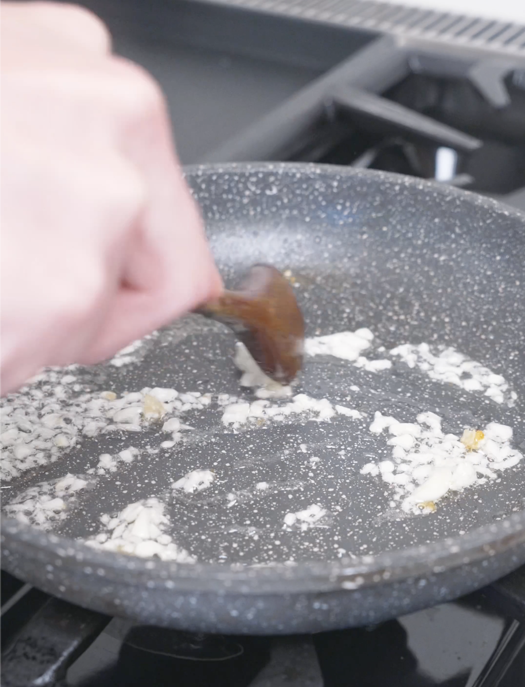Minced garlic being stirred in the same pan until fragrant for Creamy Gochujang Chicken Recipe.