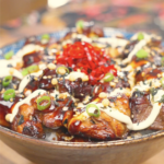 Finished Garlic Teriyaki Chicken Recipe over rice with kewpie mayo, soy glaze, furikake, scallions, and pickled ginger.