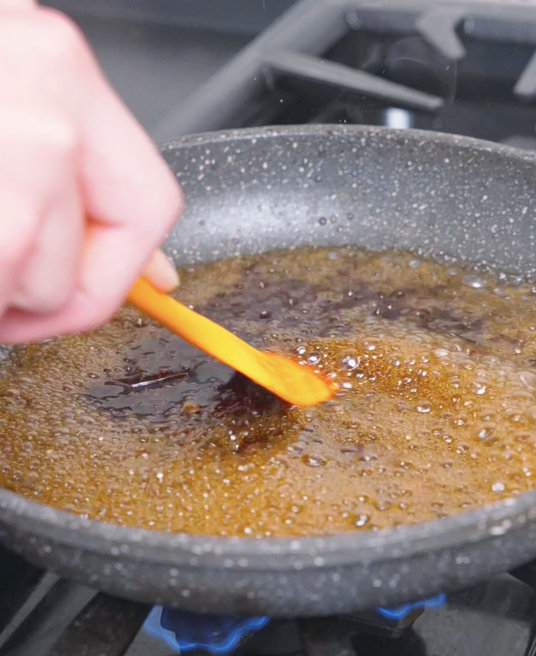 The garlic soy sauce bubbling and reducing in the pan until slightly thickened for Japanese Steak Bowl Recipe.