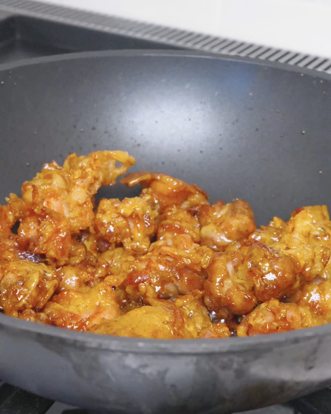 Chicken tossed until each craggy piece is lacquered in honey glaze for Sweet Honey Fried Chicken Recipe.